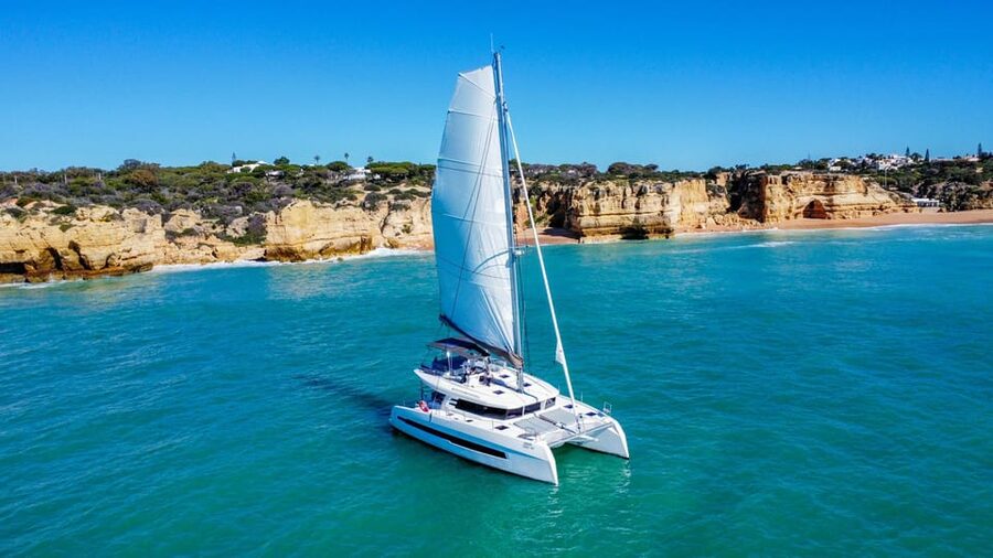 Albufeira: Algarve Half-Day Private Catamaran Charter - Cruising toward Benagil Cave