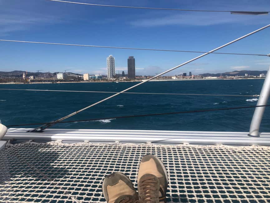Barcelona: Shared cruise on luxury catamaran Drinks + Snacks - Tibidabo and the hills behind Barcelona