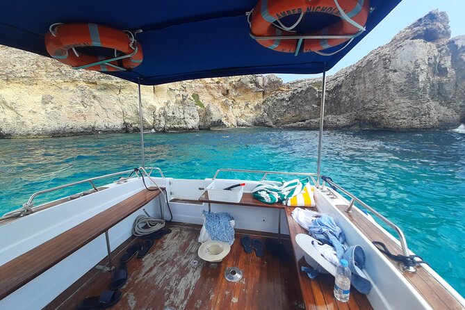 Boat Charters Blue lagoon, Crystal Lagoon, Comino, Malta 4hr trip - San Niklaw Bay closes the route