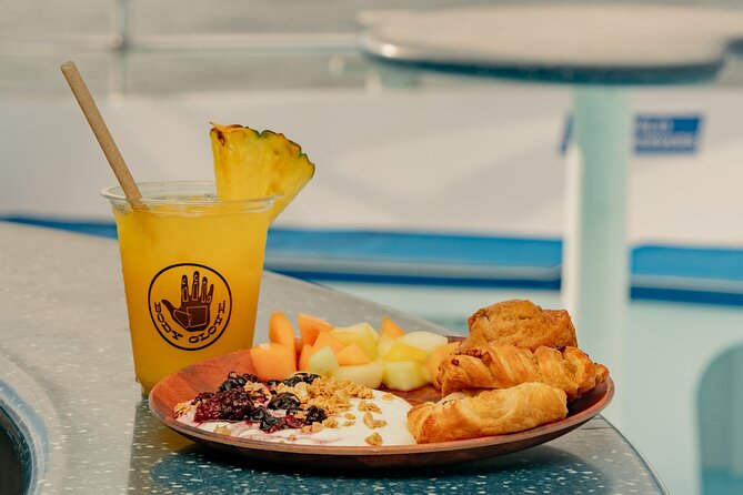 Deluxe Snorkel & Dolphin Watch Aboard a Luxury Catamaran from Kailua-Kona - Slides, high jumps, and floating toys