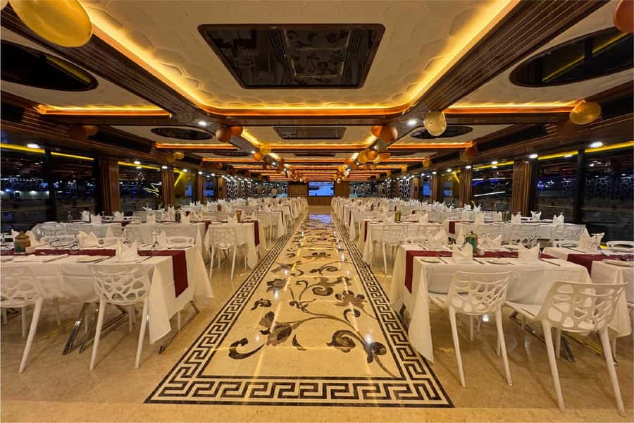 Dubai: Mega Yacht Dinner Cruise with Buffet - Tanoura dancers, aerial acts, and DJ music