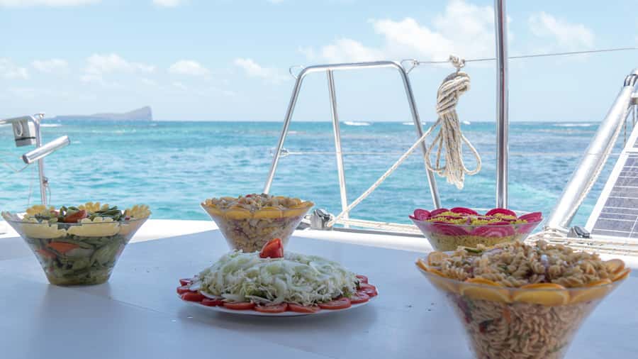 Full Day Catamaran Luxury Cruise to Northern Islands w Lunch - Passing the Cliffs of Gunners Coin