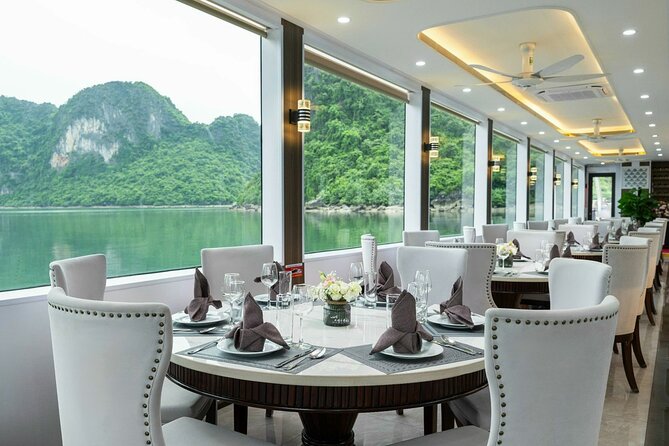 Full day Halong Bay Luxury Cruise - buffet lunch, kayak, swim. - Titop Island offers a beach, a swim, and a 500-step view