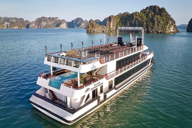 Halong Bay Day Tour Luxury Cruise With Jacuzzi and Buffet Lunch - Sunset fruit, cake, and the ride back