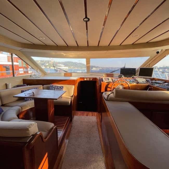 Istanbul: Bosphorus Morning or Sunset Yacht Tour with Snacks - Sailing past Dolmabahce Palace