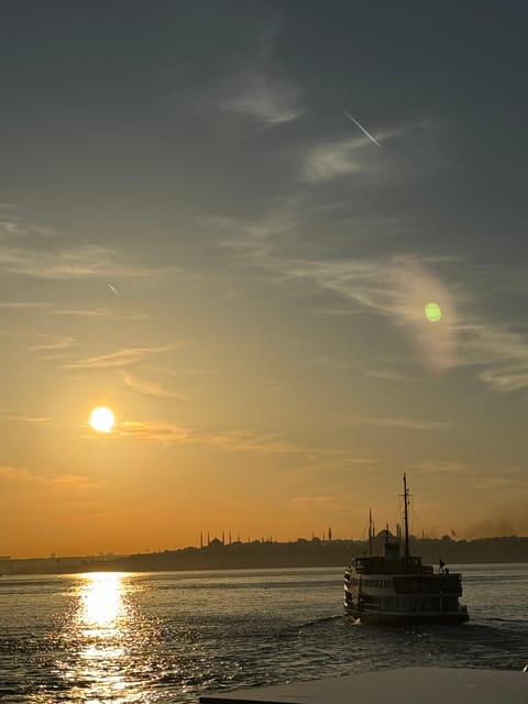 Istanbul: Bosphorus River Sunset Yacht Tour with Commentary - Sunset timing, weather, and the open deck