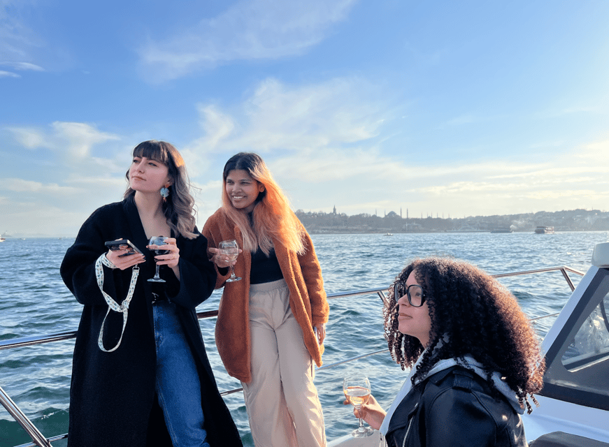 Istanbul: Small Group Yacht Tour with Unlimited Wine - Crossing toward Asia beneath the Bosphorus Bridge