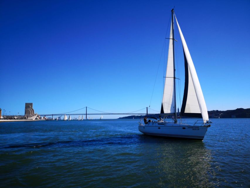 Lisbon: Yacht Sailing Tour With Portuguese Wine and History - Cristo Rei and the south bank