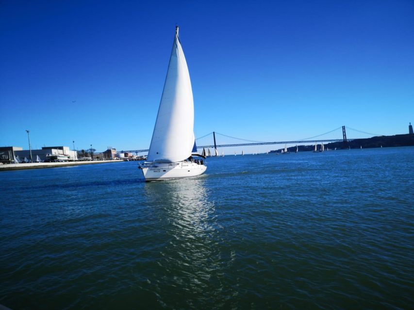Lisbon: Yacht Sailing Tour With Portuguese Wine and History - Under the 25 de Abril Bridge