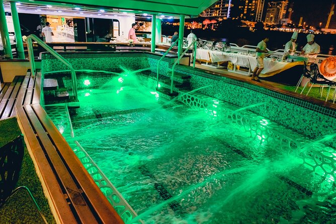 Lotus Mega Yacht Luxury Cruise with Live DJ, Dinner & Transfers - Open decks, pool, jacuzzi, and VIP seating