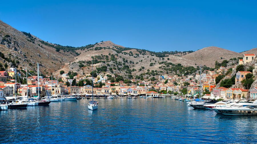 Luxury Boat Trip to Symi Island with Swimming at St. George - Arriving at Symi Harbour