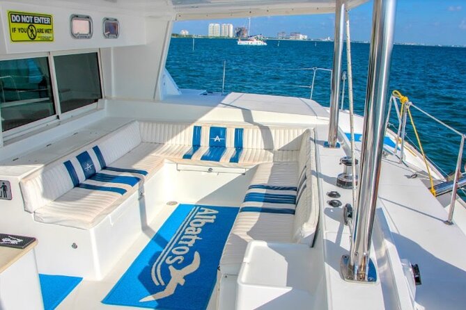 Luxury Catamaran Tour to Isla Mujeres with Transportation - The return sail: music, drinks, and a possible spinnaker flight
