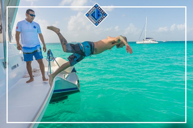 Luxury Catamaran tour to isla mujeres with transportation from Tulum - Spinnaker rides, swimming, and the return sail