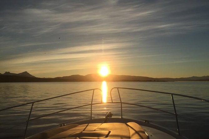 Midningtsun - Luxury Yacht Arctic Queen - Tromsø from the water, with mountains and islands all around