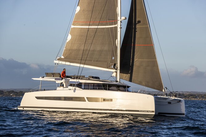 Mykonos: Luxury Catamaran Cruise with Meal, Drinks & Transport - Swimming, snorkeling, and water toys