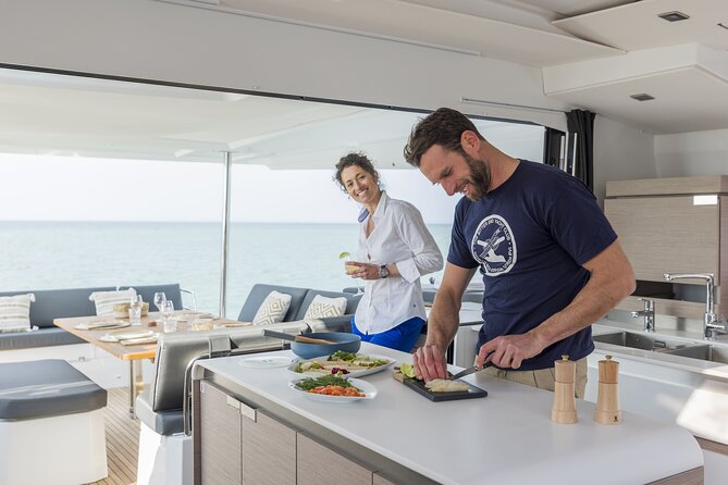 Mykonos: Luxury Catamaran Cruise with Meal, Drinks & Transport - Weather, timing, and cancellation details