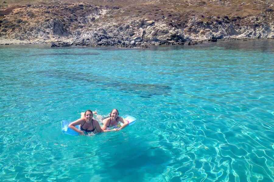 Mykonos: Yacht Cruise to Rhenia and Guided Tour of Delos - Leaving Mykonos under sail