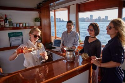 NYC: Sunset Cruise on a Small Yacht with a Drink