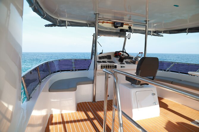 Phi Phi Island & Maiton Island Full Day Tour with Luxury Yacht - Monkey Beach, where nature meets a busy boat day