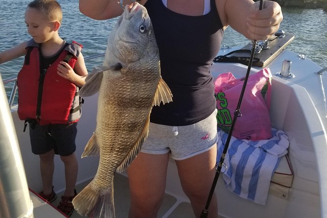 Private Fishing Boat Charters in Naples Bay and the Gulf - Sun, rain, and comfort on an open boat