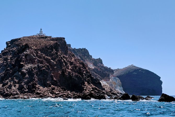 Private Full-Day Motor Yacht Cruise with Meal, Open Bar+Transfers - Lighthouse, Indian Rocks, and the Caldera