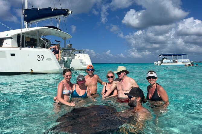 Private Luxury Catamaran Tour to Stingray City and Snorkel - Booking, weather, and cancellation details