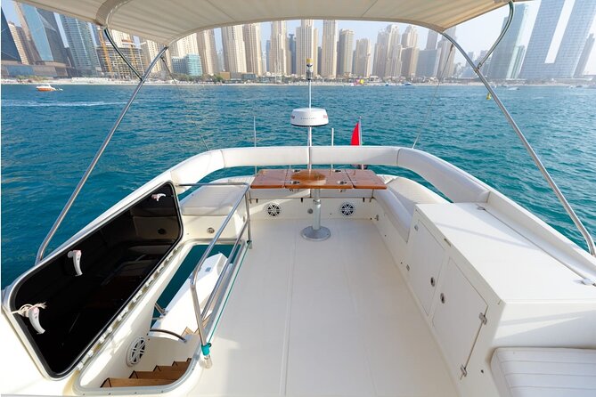 Private Yacht Cruising Rental from Dubai Marina - Indoor comfort, shaded seating, and crew service