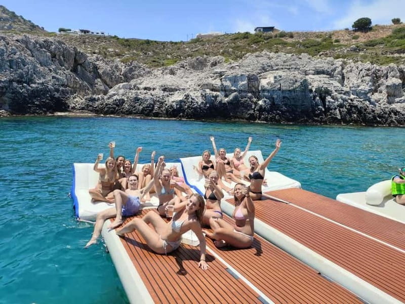 Rhodes: Gulet Trip with Food, Drinks, SUP, Kayak & Swimming - Greek lunch, morning pastries, and afternoon fruit