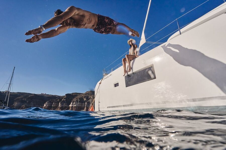 Santorini: Caldera Luxury Catamaran Cruise w/ Meal & Drinks - Red Beach from the water