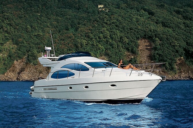 Santorini Caldera: Private Flybridge Yacht Experience - Mesa Pigadia and the black volcanic rock