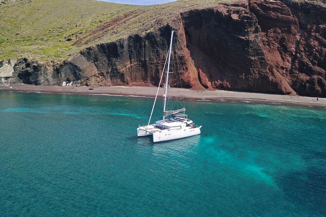 Santorini: Luxury Catamaran Cruise with Fresh Fish BBQ & Drinks - Mesa Pigadia: the best swim stop
