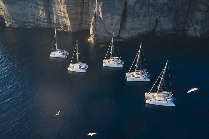 Santorini: Luxury Catamaran Cruise with Fresh Fish BBQ & Drinks - Nea Kameni barbecue: the heart of the afternoon