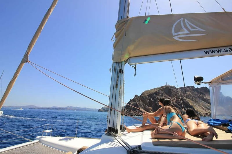 Santorini: Luxury Catamaran Cruise with Lunch, BBQ & Drinks - Entering the Caldera and approaching the hot springs