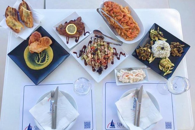 Santorini Luxury Catamaran Day Cruise with BBQ,drinks,transfer - Red Beach and the colored cliffs