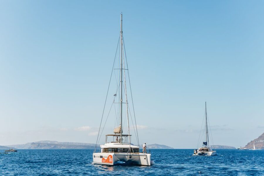 Santorini: Luxury Catamaran Day Trip with Meal and Open Bar - Red Beach and White Beach from the water