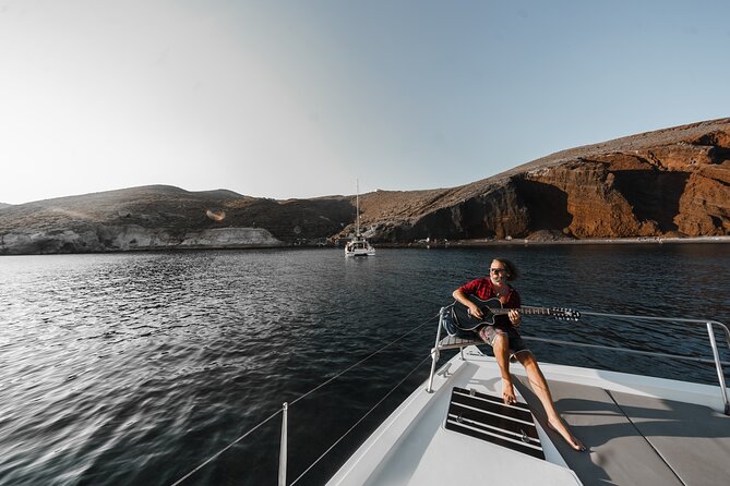 Santorini Luxury Catamaran Private Cruise - The lighthouse and Indian Rock from the sea