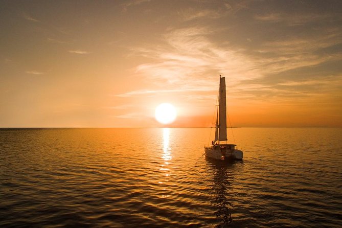 Santorini Luxury Catamaran Sunset Cruise with BBQ, Drink and Transfer - White Beach, barbecue, and the longest stop