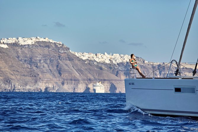 Santorini Luxury Sailing Catamaran Cruise with BBQ, Drinks and Transfer - White Beach, lunch, and the longest stop