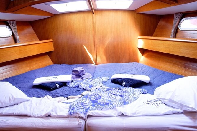 Santorini: Private Sailing Yacht Cruise with Meal and Drinks - Mesa Pigadia for a short swim