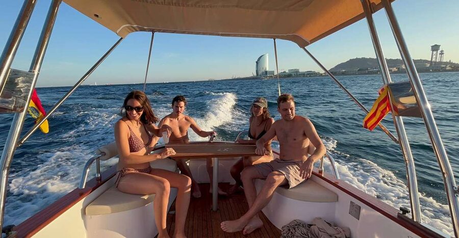 Sunset from a private Classic Yacht - Leaving Port Olimpic as Barcelona Winds Down
