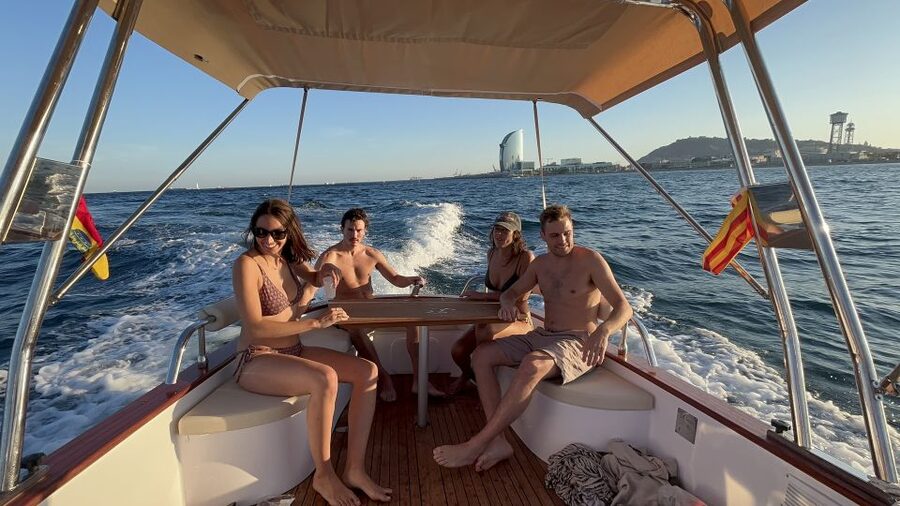 Sunset from a private Classic Yacht - A Two-Hour View of Barcelona From Offshore